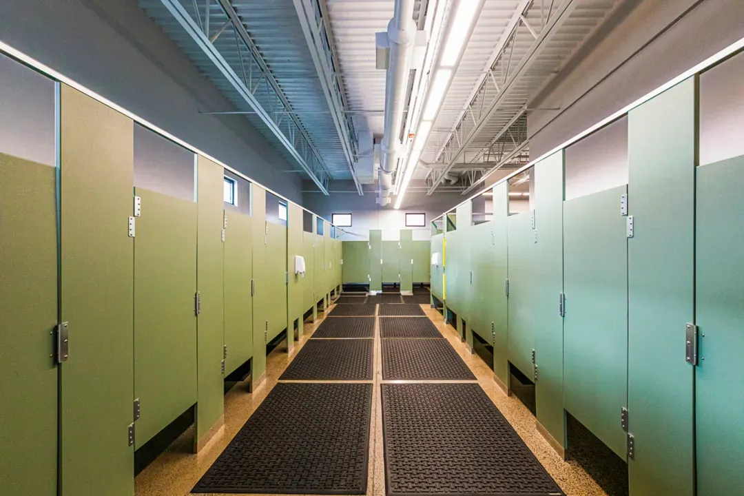 Green bathroom stalls.
