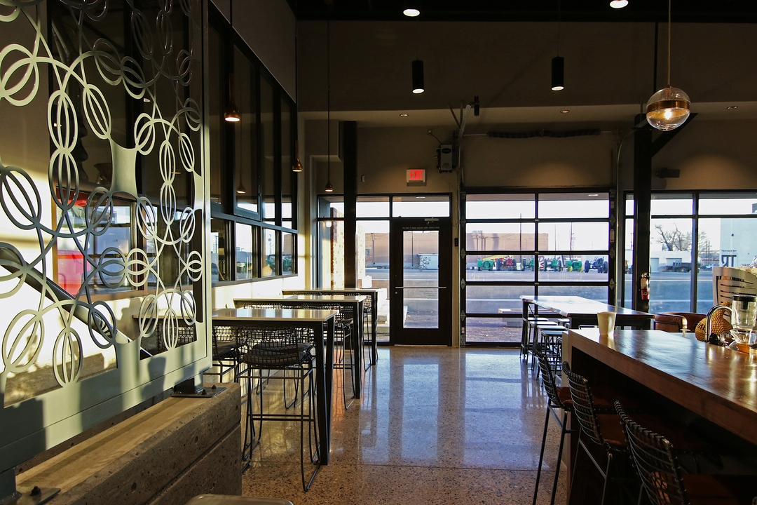 Various seating areas under orb lights.