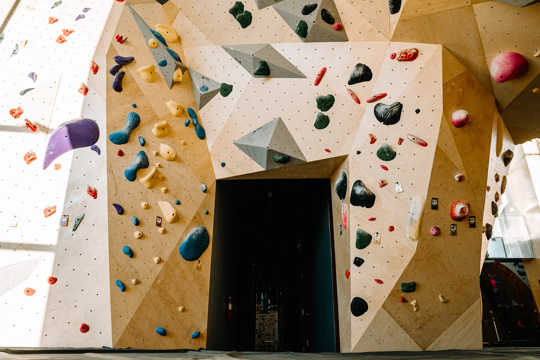 Climbing wall surrounding doorway.