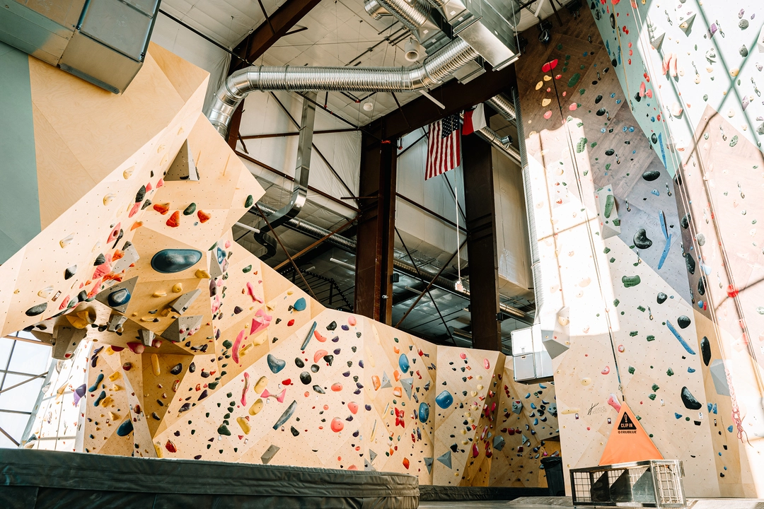 View of climbing wall sections as they transition to structural elements and building columns.