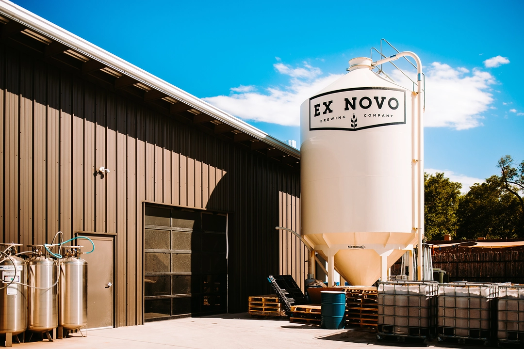 Huge, two-story tall fermenter next to Ex Novo building.