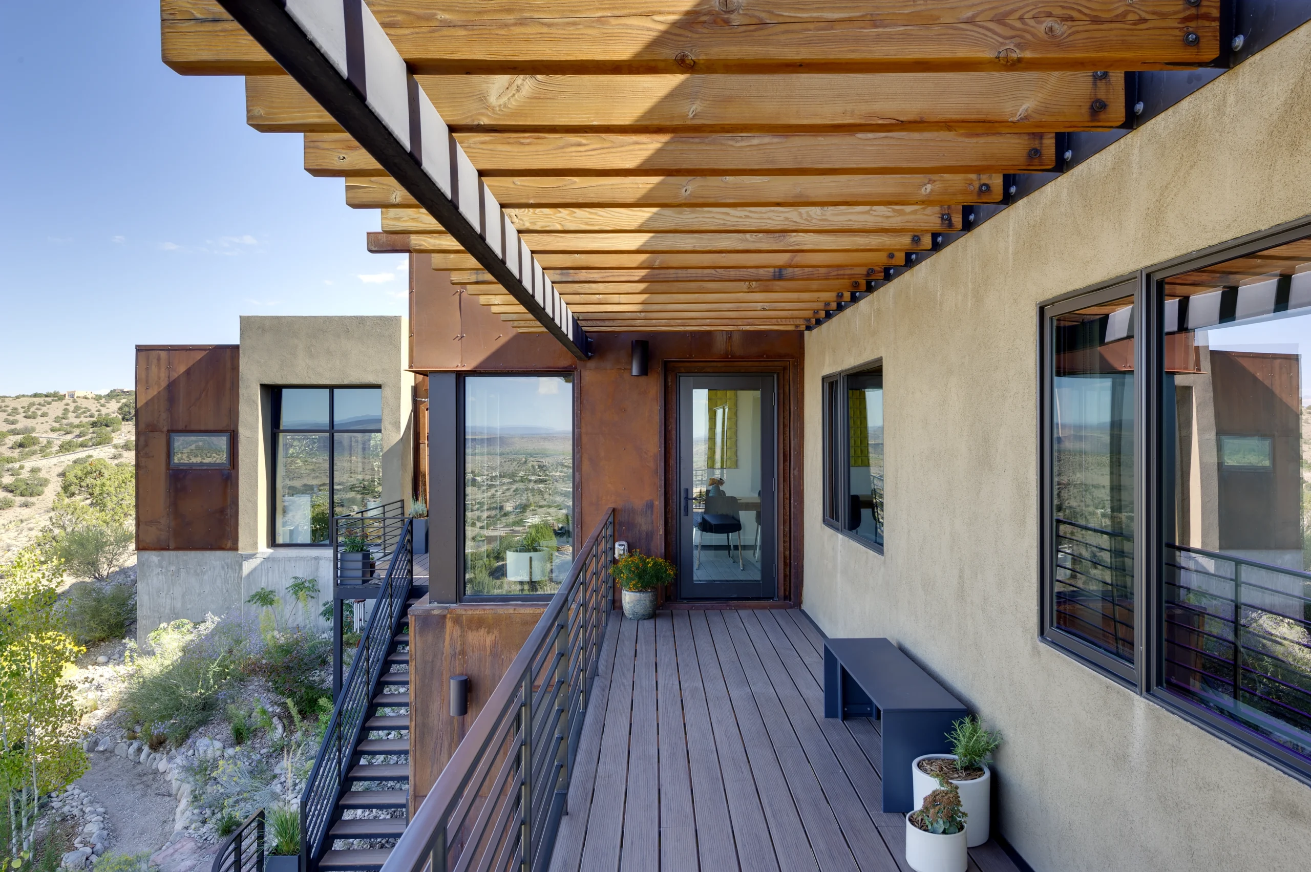 Modern home balcony with steel and wood finishes