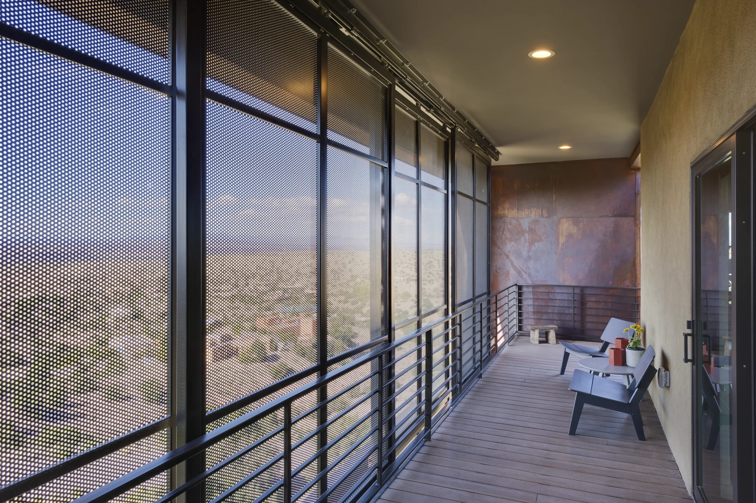 Two chairs on the balcony overlooking the desert
