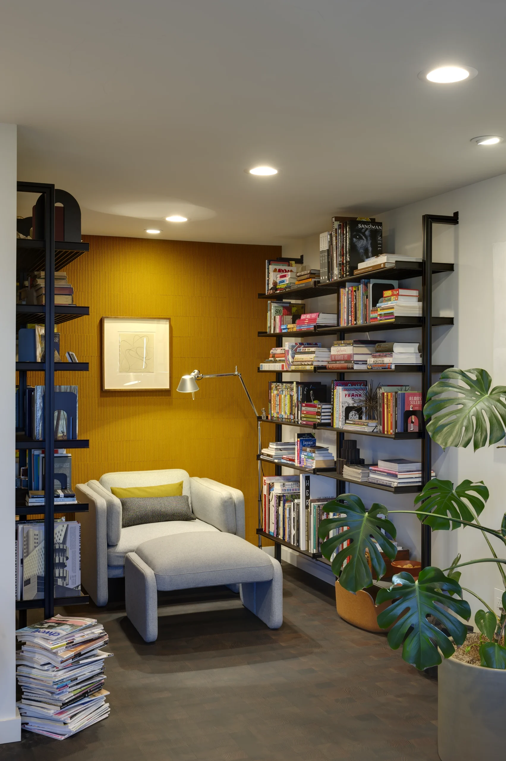 Modern reading nook with a mustard yellow wall