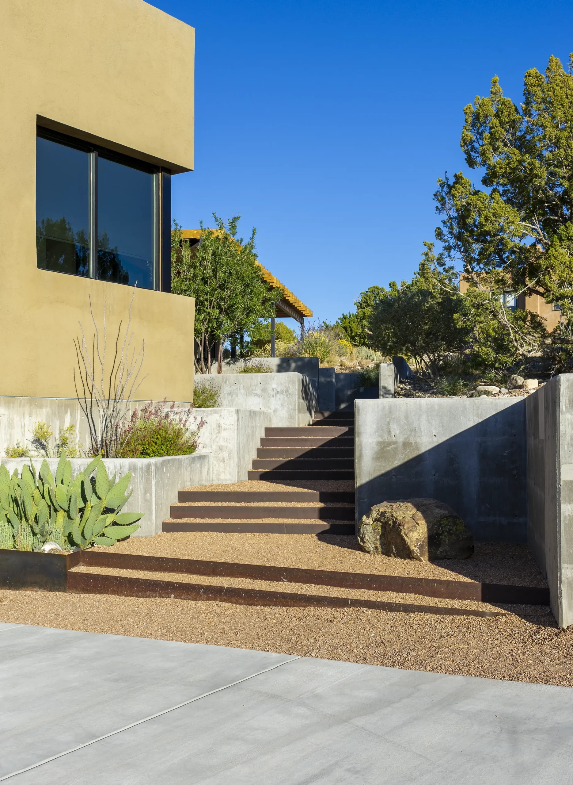 Modern home with steps going to balcony area