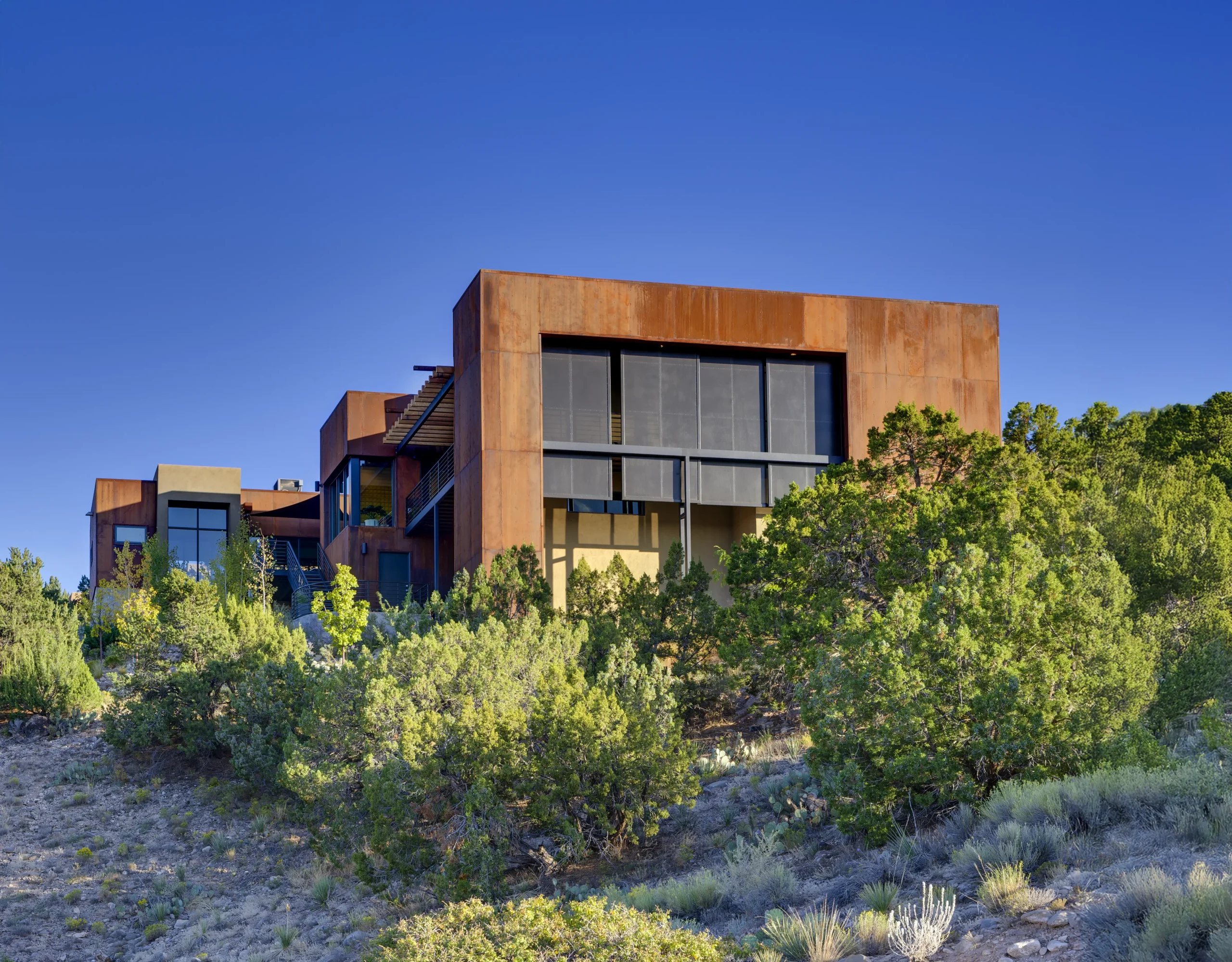 Modern home with steel finishes at sunset