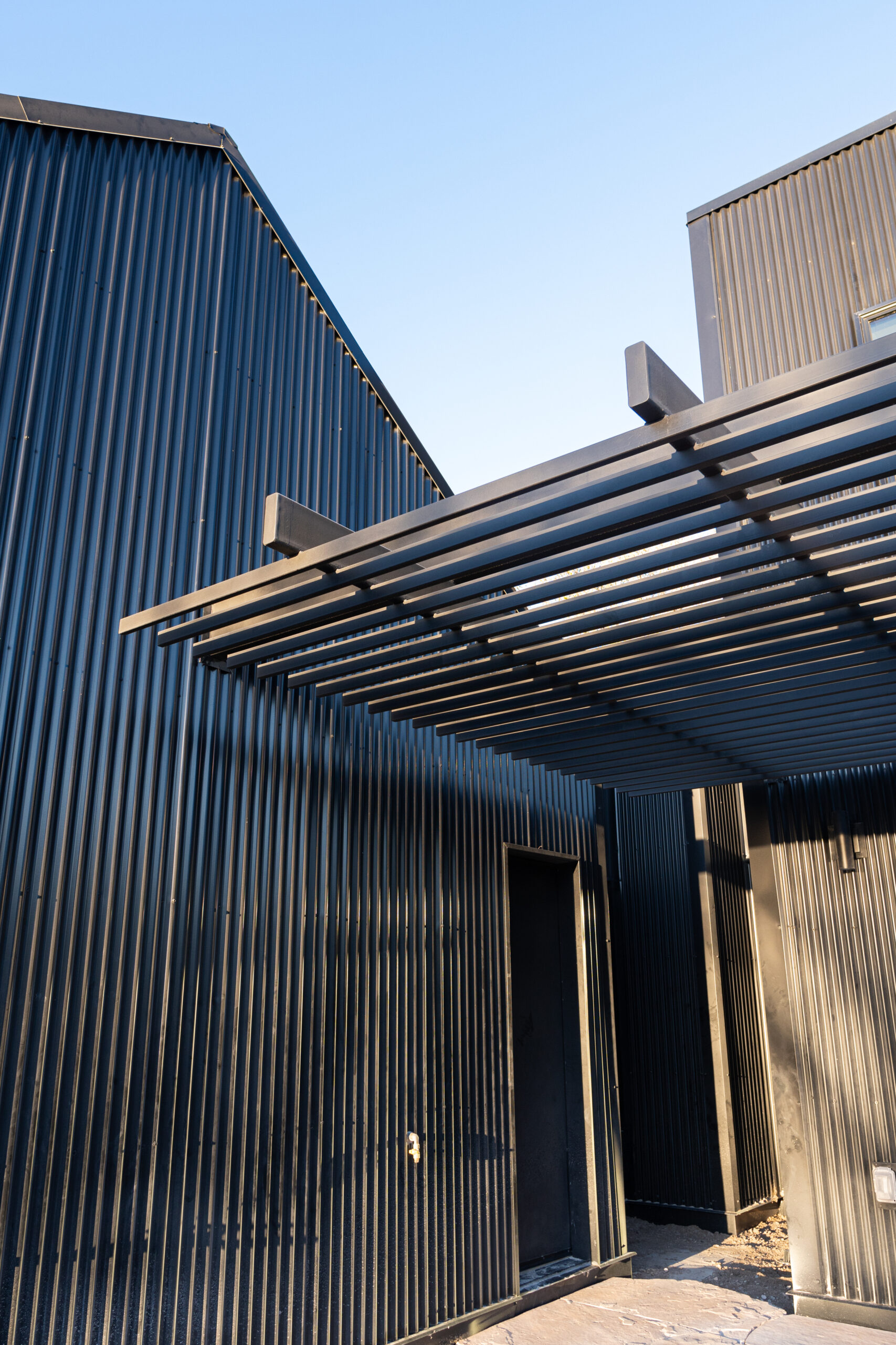 Masters and Borin property exterior with steel finishes fabricated by Modulus Design