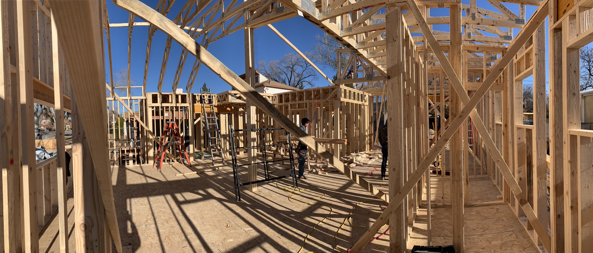 Workers constructing and building a house