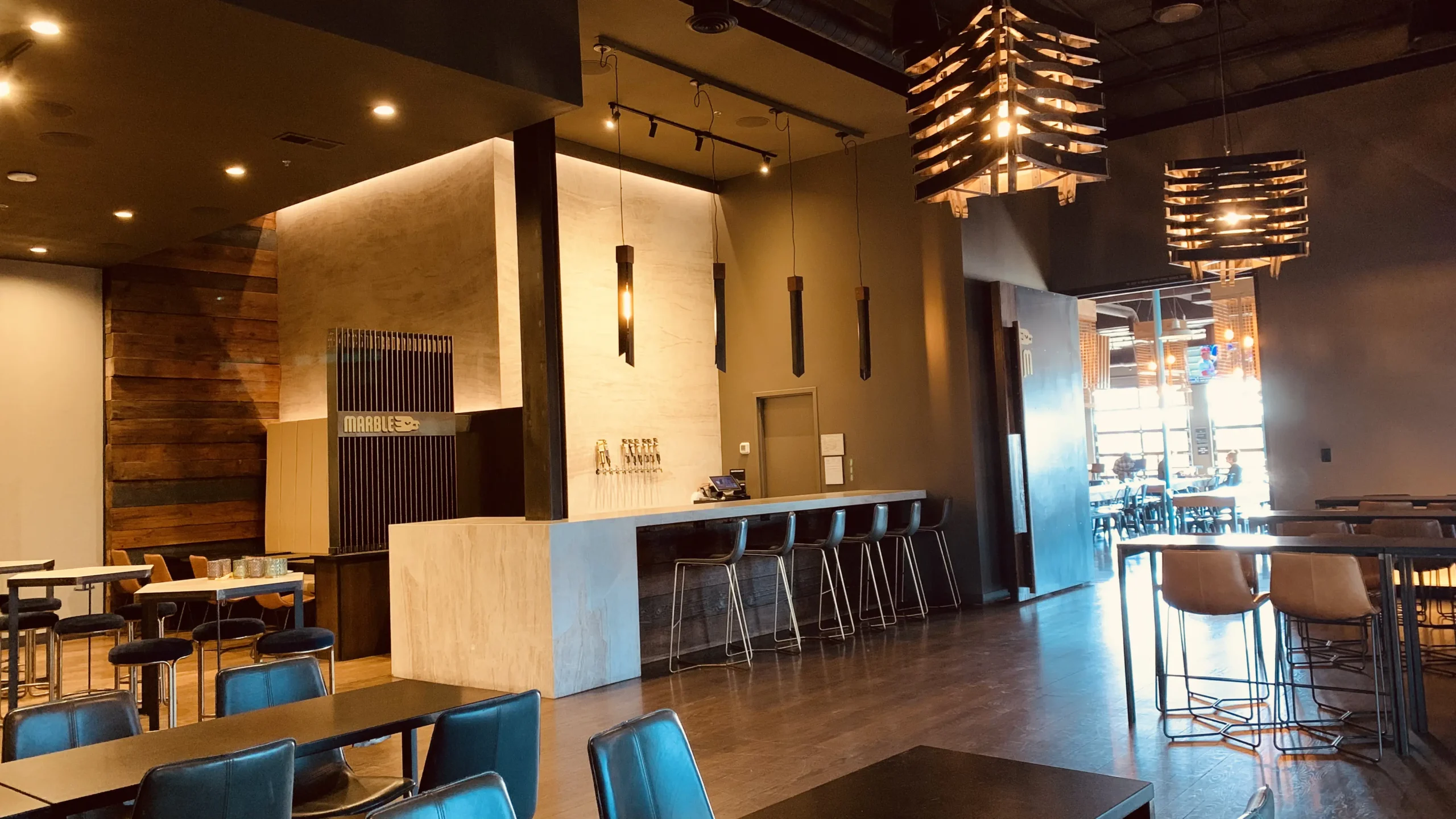 Interior of Marble Brewery Heights location with modern, sleek wooden and steel finishes